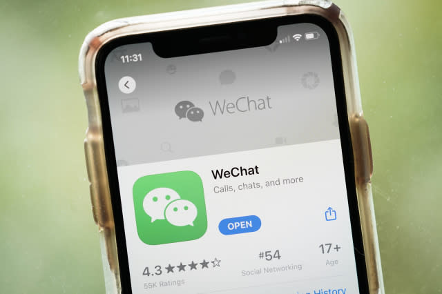 WASHINGTON, DC - AUGUST 07: In this photo illustration, the WeChat app is displayed in the App Store on an Apple iPhone on August 7, 2020 in Washington, DC. On Thursday evening, President Donald Trump signed an executive order that bans any transactions between the parent company of TikTok, ByteDance, and U.S. citizens due to national security reasons. The president signed a separate executive order banning transactions with China-based tech company Tencent, which owns the app WeChat. Both orders are set to take effect in 45 days. (Photo Illustration by Drew Angerer/Getty Images)