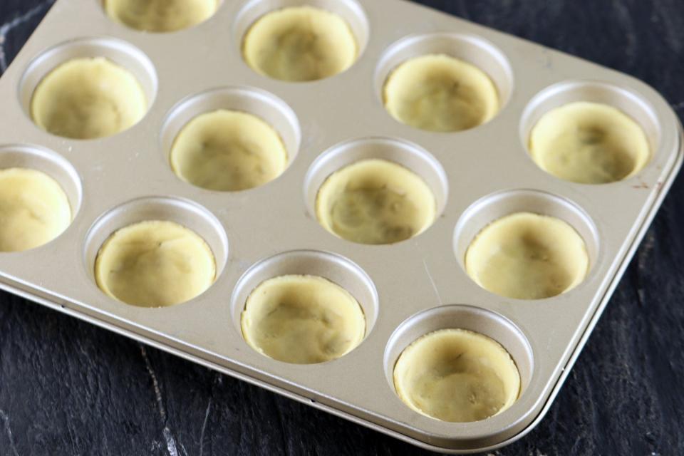 Place circular-cut dough in cupcake baking pan.