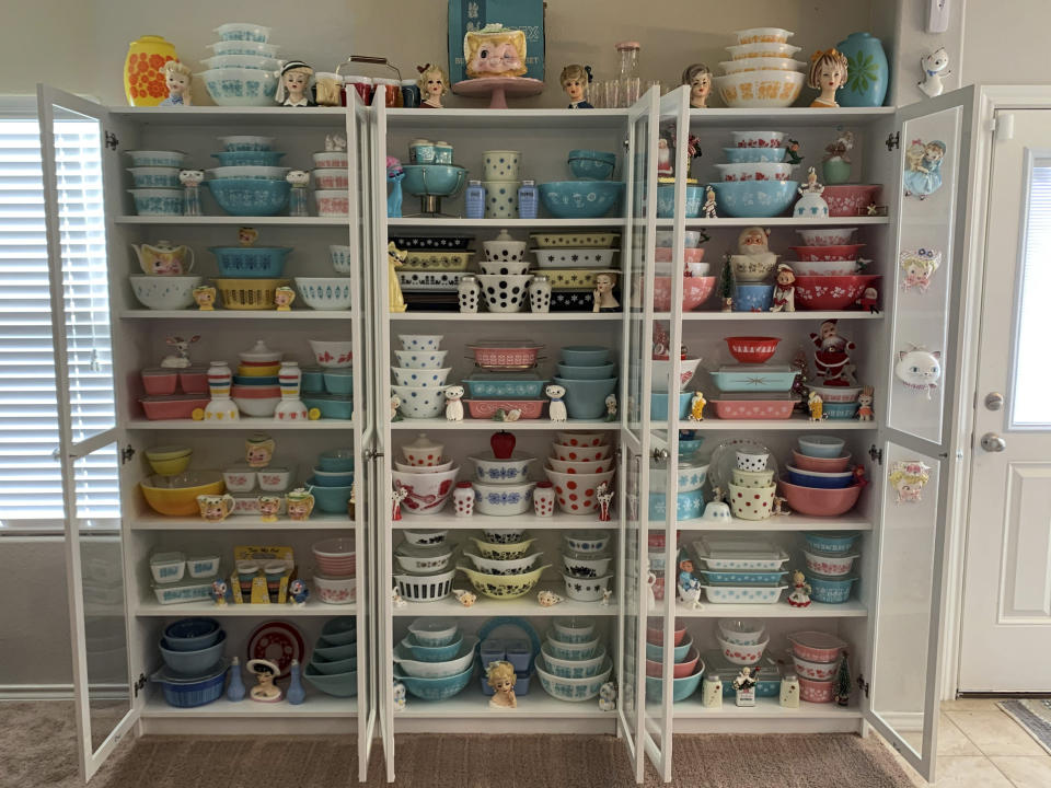 This image provided by Megan Telfer shows the wide selection of antique Pyrex dishes she displays at her Texas home. Telfer has more than 300 pieces of vintage Pyrex, displayed on three large bookcases. Telfer's 5-year-old daughter has some vintage Pyrex, too. "We don't use 90 percent of it," Telfer said. "I display it." (Megan Telfer via AP)
