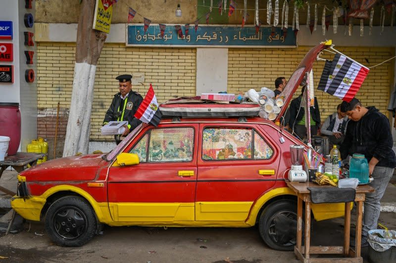 Supporters of the ruling party celebrated near a polling station on Sunday. Photo by Thomas Maresca/UPI