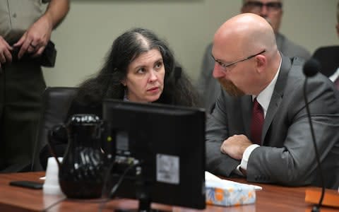 Louise Turpin, left, listens to her attorney, Jeff Moore, during a sentencing hearing Friday - Credit: AP