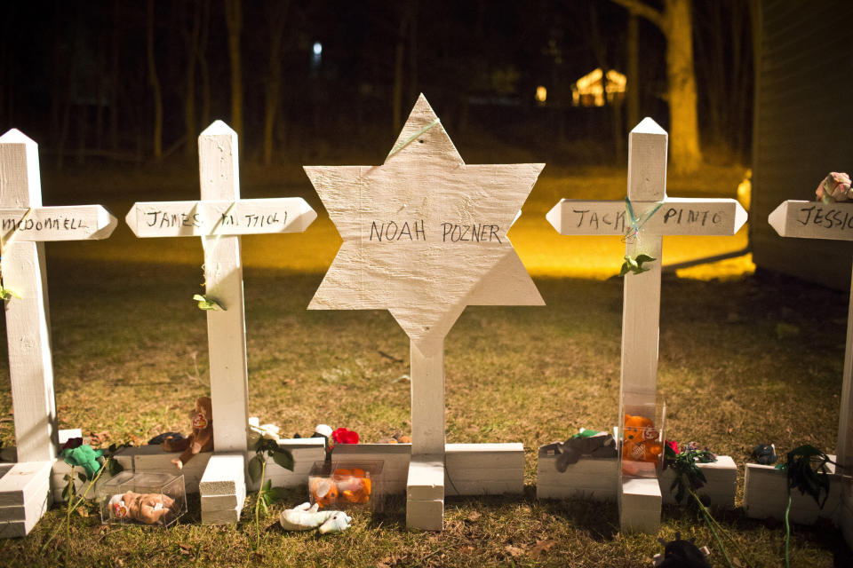 A Star of David for Noah Pozner is seen amongst 25 crosses at a memorial for those killed in the massacre at Sandy Hook Elementary School. (Photo: Andrew Burton / Reuters)