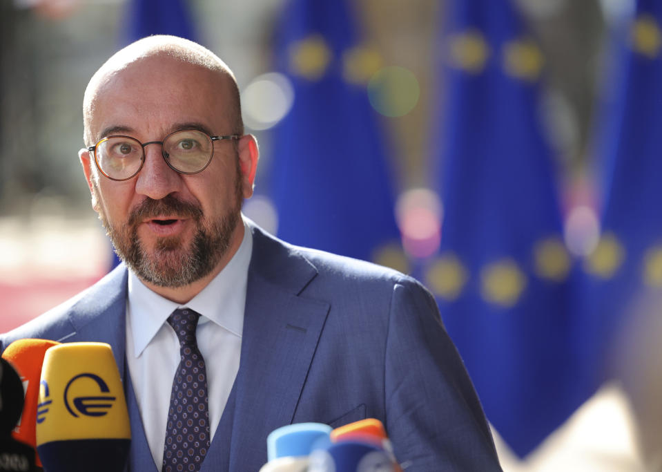 European Council President Charles Michel speaks with the media as he arrives for an EU summit in Brussels, Thursday, June 23, 2022. European Union leaders are expected to approve Thursday a proposal to grant Ukraine a EU candidate status, a first step on the long toward membership. The stalled enlargement process to include Western Balkans countries in the bloc is also on their agenda at the summit in Brussels. (AP Photo/Olivier Matthys)