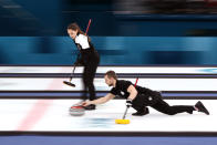 <p>Aleksandr Krushelnitckii of Olympic Athletes from Russia delivers a stone against Norway during the Curling Mixed Doubles Bronze Medal Game on day four of the PyeongChang 2018 Winter Olympic Games at Gangneung Curling Centre on February 13, 2018 in Gangneung, South Korea. (Photo by Jamie Squire/Getty Images) </p>