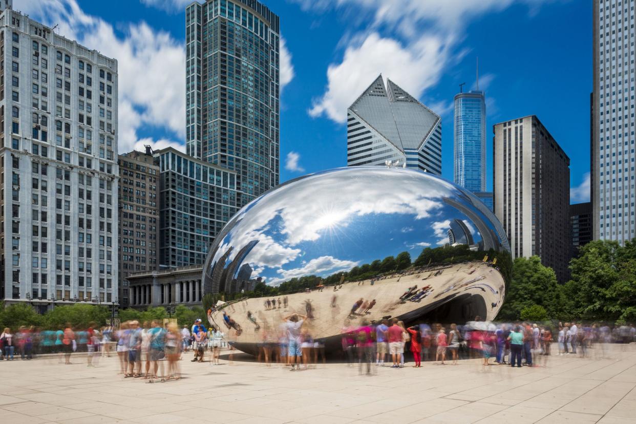 Chicago, Illinois, USA - July 3, 2014: Tourists around the Cloud Gate (