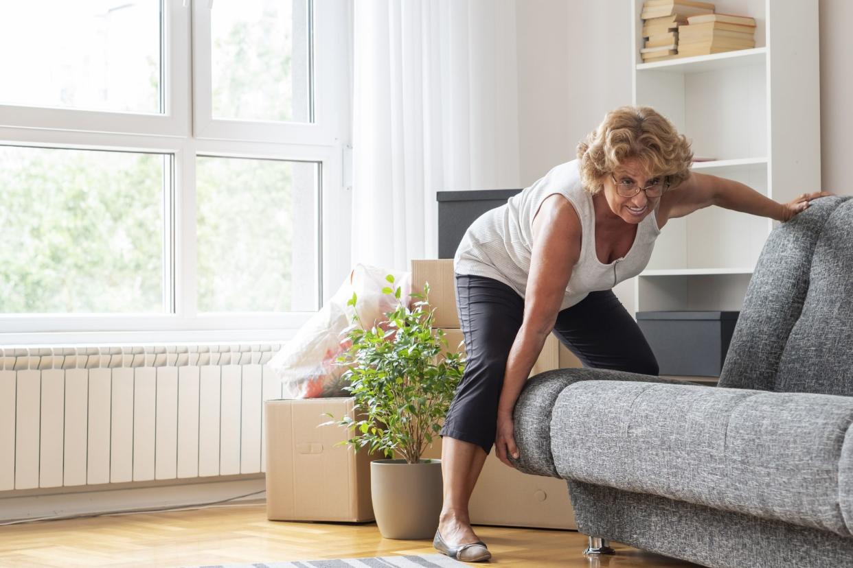 Senior woman moving into a new apartment.