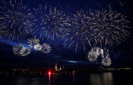 Fireworks explode over the Peter and Paul Fortress during the Scarlet Sails festivities marking school graduation, in St. Petersburg, Russia,June 24, 2018. REUTERS/Henry Romero