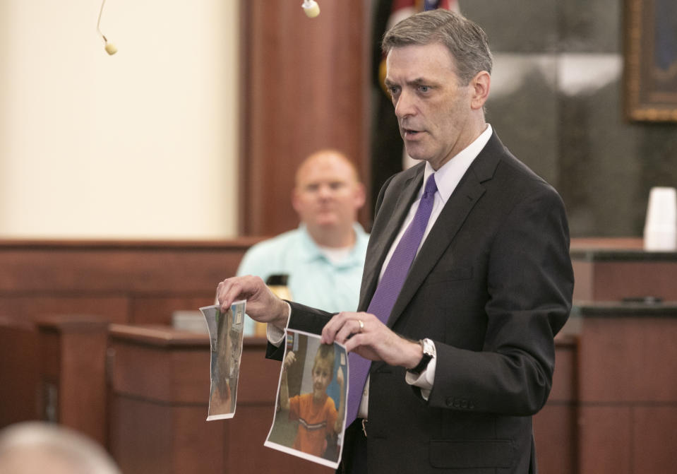 11th Circuit Solicitor Rick Hubbard shows the jury photographs of Nahtahn Jones with bruises on his neck and arms during the sentencing phase of the trial of Tim Jones in Lexington, S.C. on Friday, June 7, 2019. Jones, was found guilty of killing his 5 young children in 2014. (Tracy Glantz/The State via AP, Pool)