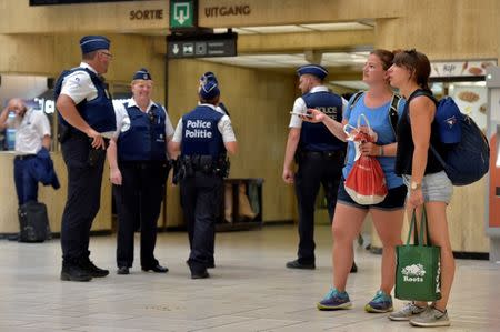 Belgian police officers stand guard in central station in Brussels, Belgium June 21, 2017. REUTERS/Eric Vidal