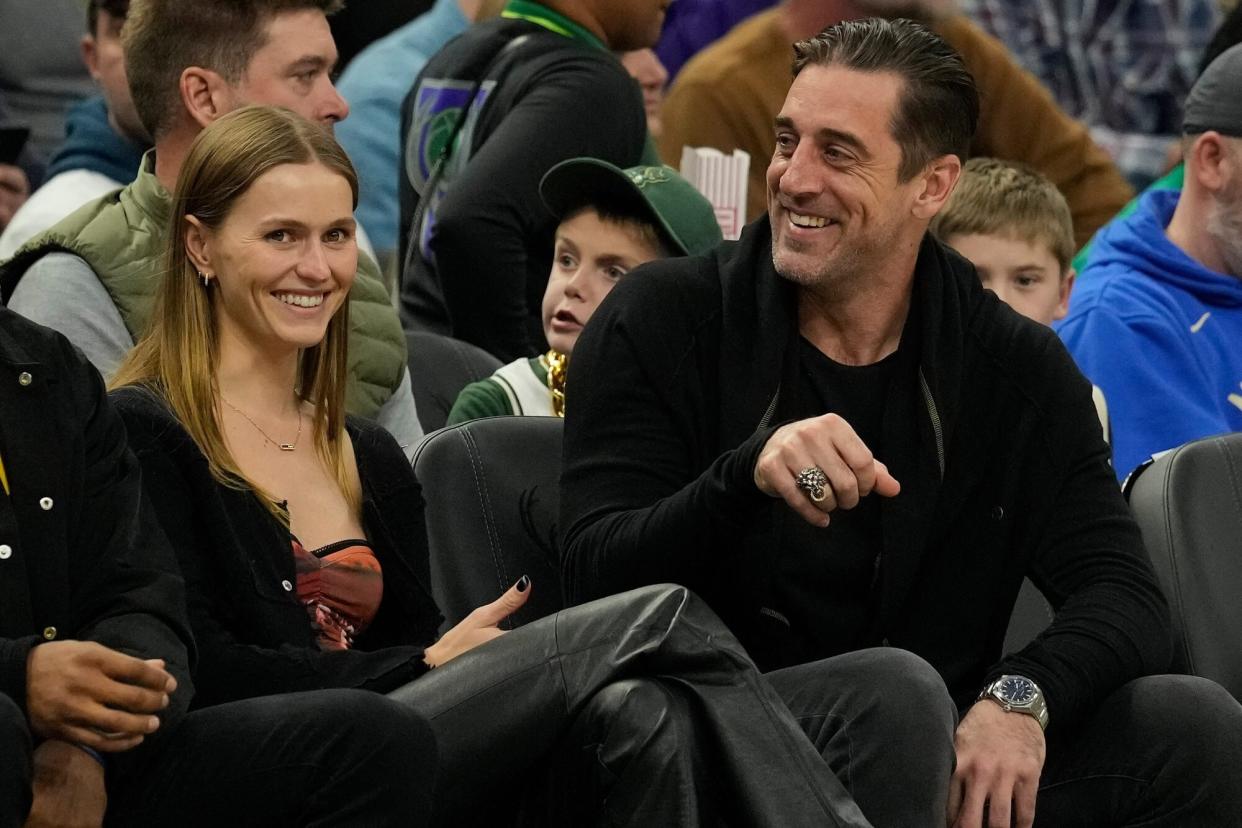 MILWAUKEE, WISCONSIN - DECEMBER 02: (L-R) Green Bay Packers wide receiver Randall Cobb, Mallory Edens, and Green Bay Packers quarterback Aaron Rodgers watch the second half of the game between the Los Angeles Lakers and Milwaukee Bucks at Fiserv Forum on December 02, 2022 in Milwaukee, Wisconsin. NOTE TO USER: User expressly acknowledges and agrees that, by downloading and or using this photograph, User is consenting to the terms and conditions of the Getty Images License Agreement. (Photo by Patrick McDermott/Getty Images)