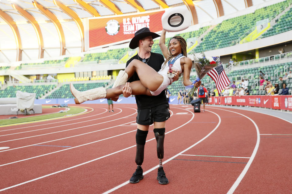 Tara Davis, second place in the Women's Long Jump Final, celebrates with boyfriend and Paralympian Hunter Woodhall on day 9 of the 2020 U.S. Olympic Track & Field Team Trials at Hayward Field on June 26, 2021, in Eugene, Oregon. / Credit: Steph Chambers/Getty Images