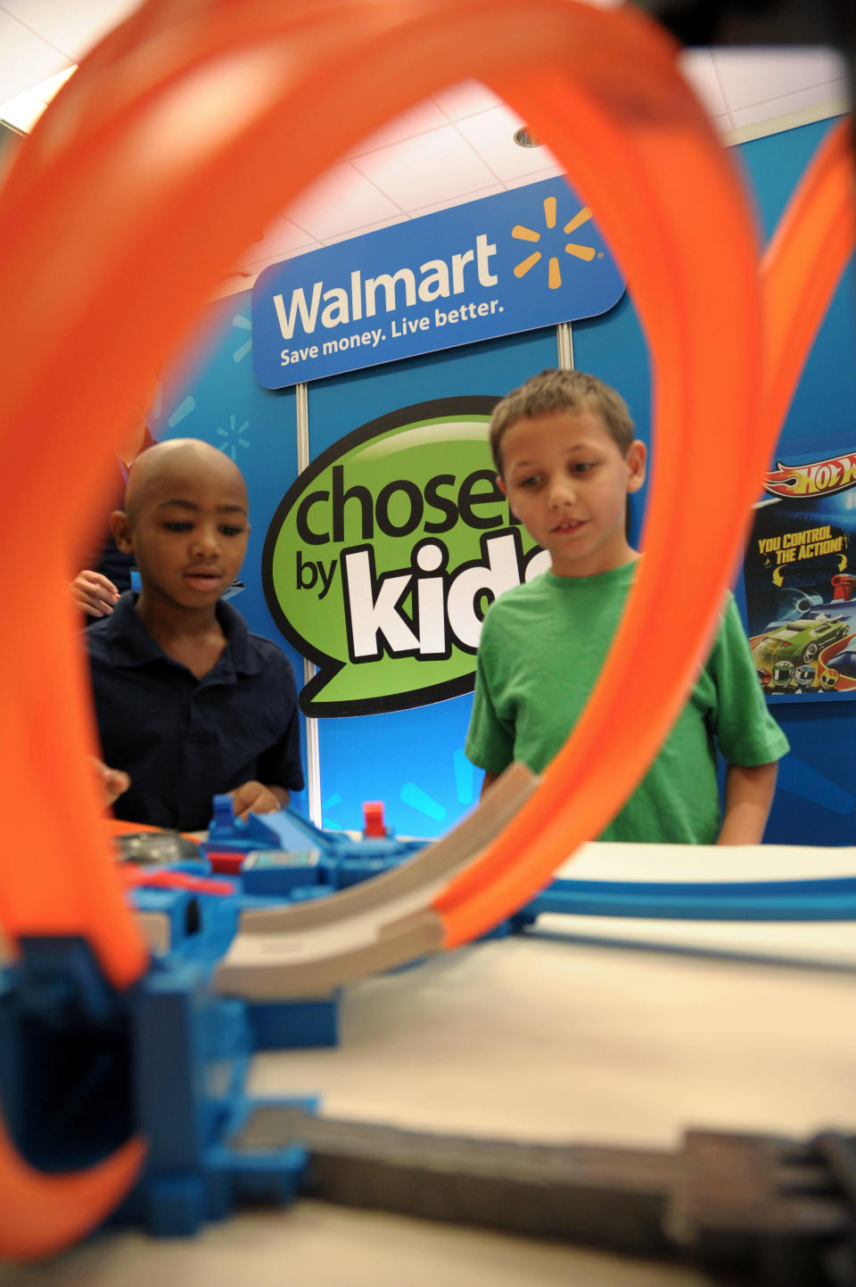 In this undated photo provided by Wal-Mart, two of about 1,000 boys and girls aged 18 months to 10 years play with a toy as part of an event during August 2013 in Dallas. The children chose their favorites, resulting in a top 20 list of kid-approved toys. (AP Photo/Wal-Mart)