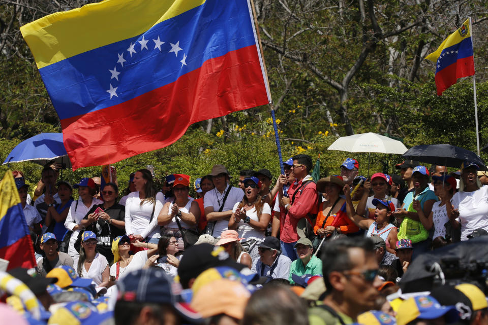 Anti-government protesters start to gather for a rally to demand the resignation of Venezuelan President Nicolas Maduro in Caracas, Venezuela, Monday, March 4, 2019. The United States and about 50 other countries recognize opposition Congress President Juan Guaido as the rightful president of Venezuela, while Maduro says he is the target of a U.S.-backed coup plot. (AP Photo/Fernando Llano)