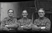 <p>Three soldiers from an unidentified regiment pose together arms crossed, and wearing identity bracelets on their wrists. The flags on the sleeve of the private in the middle show he is a qualified signaller. His companions display the rank chevrons of a corporal (left) and lance corporal (right). (Courtesy Kerry Stokes Collection, The Louis and Antoinette Thuillier Collection) </p>