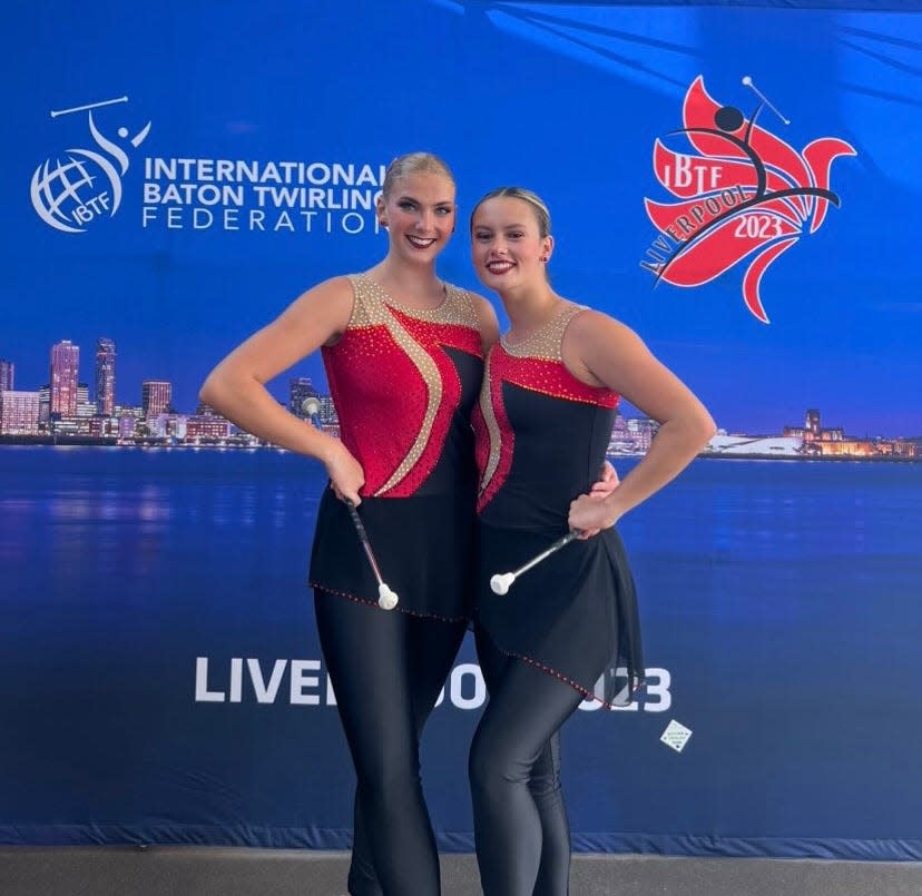 Florida State University student and Marching Chiefs majorette Lexie Stade (left) poses with another Team USA competitor at the 2023 World Baton Twirling Championship in Liverpool, England, where they won ninth place in the Nations Cup's artistic pairs competition.
