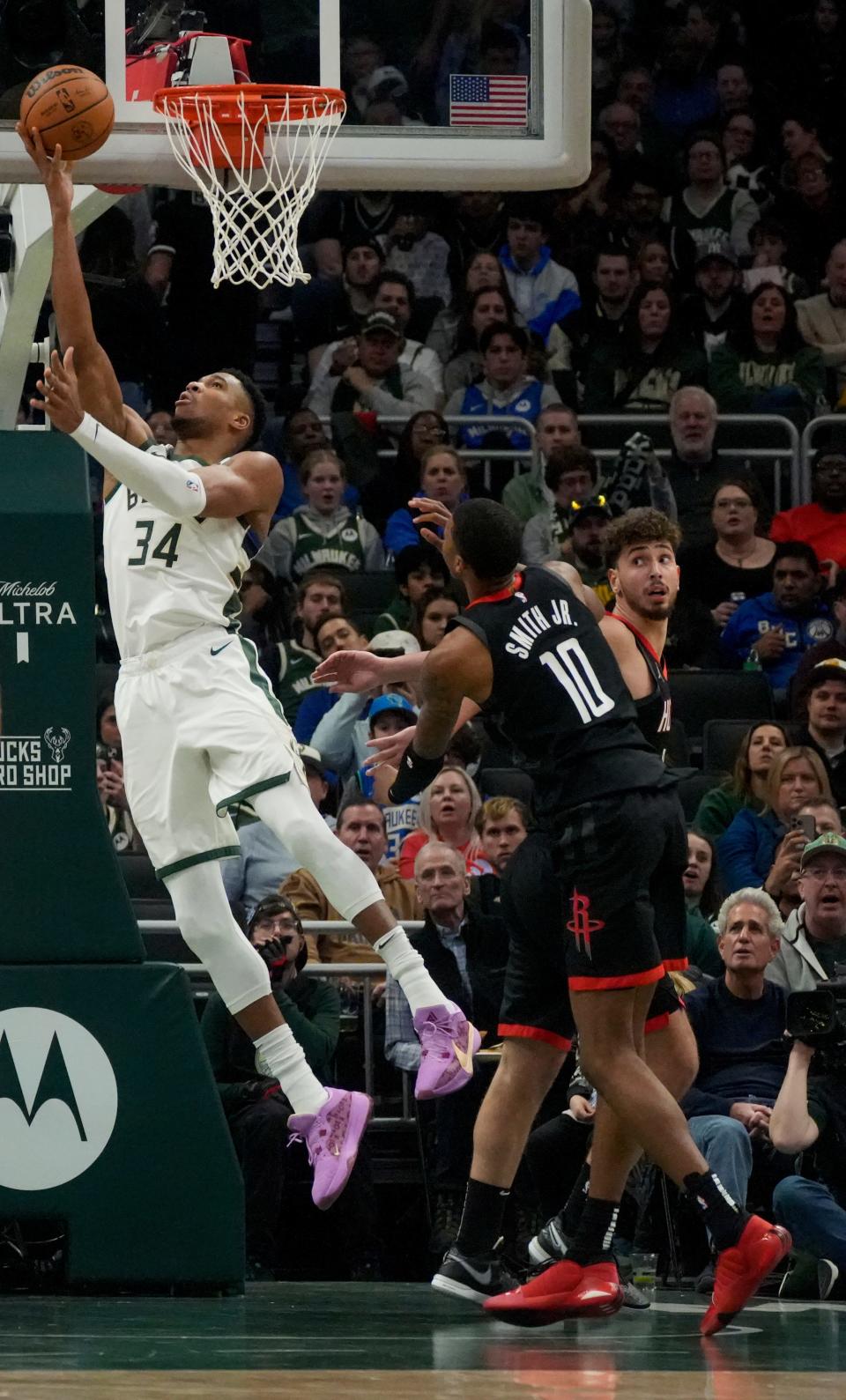 Bucks forward Giannis Antetokounmpo goes to the basket Sunday night. Antetokounmpo, who already held franchise scoring and assist records, toko the rebounding mark during during the game against the Rockets at Fiserv Forum.