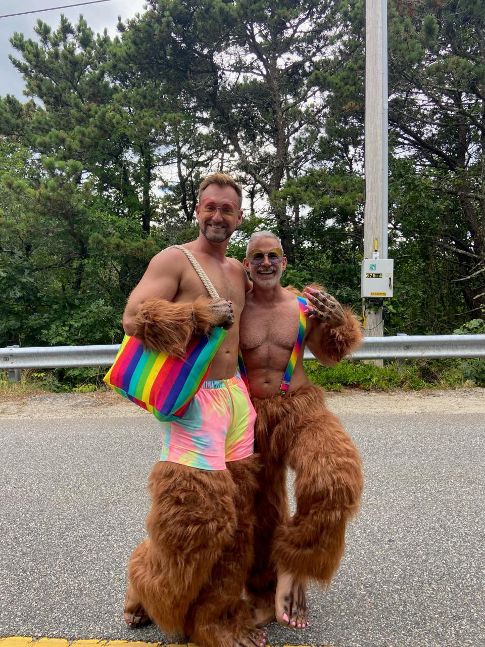 Erik Borg (left) and Lew Gallo (right) were handing out flyers on Thursday at the Carnival parade promoting the Washashore Festival scheduled for Provincetown in October. Borg has been to Carnival for 10 years; this was Gallo's first time experiencing Carnival.