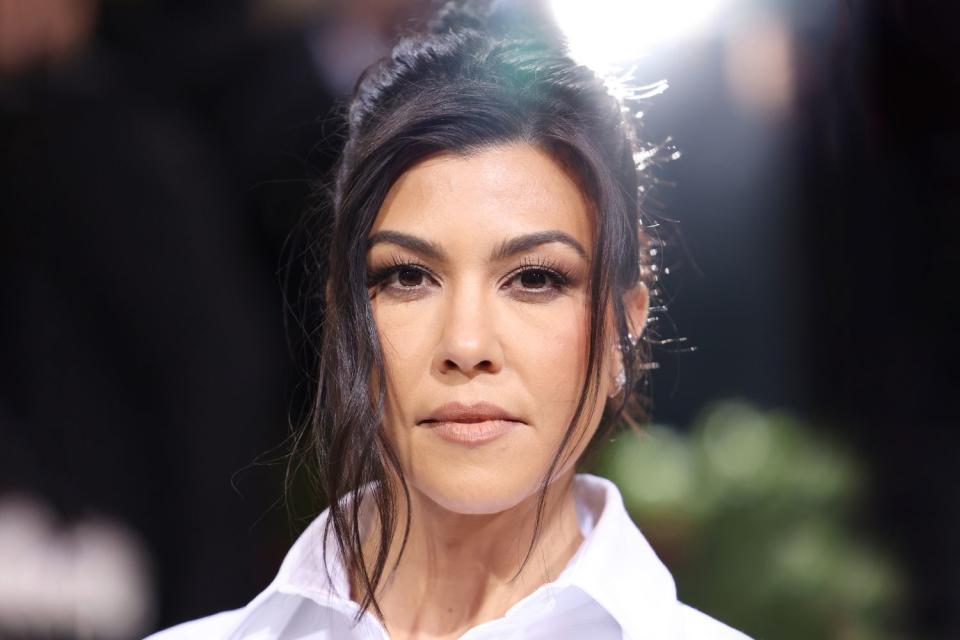 <p>John Shearer/Getty</p> Kourtney Kardashian Barker