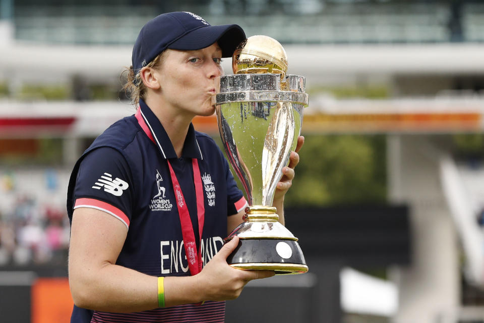 England captain Heather Knight poses with the trophy after winning the ICC Women’s World Cup
