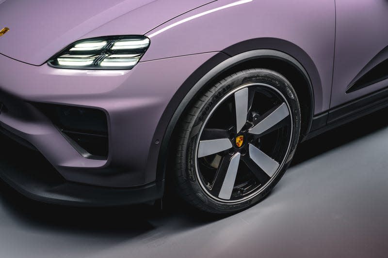 Front corner and wheel of a lavender 2024 Porsche Macan EV