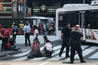 <p>First responders are at the scene as people help injured pedestrians after a vehicle struck pedestrians on a sidewalk in Times Square in New York, on May 18, 2017. (REUTERS/Jeremy Schultz) </p>