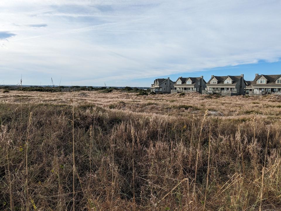 A view of "The Point" seen from a beach access with the Serenity Point community to the right.