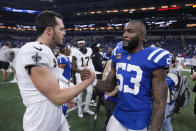 New Orleans Saints quarterback Derek Carr (4) and Indianapolis Colts linebacker Shaquille Leonard (53) shake hands after an NFL football game Sunday, Oct. 29, 2023 in Indianapolis. (AP Photo/Michael Conroy)