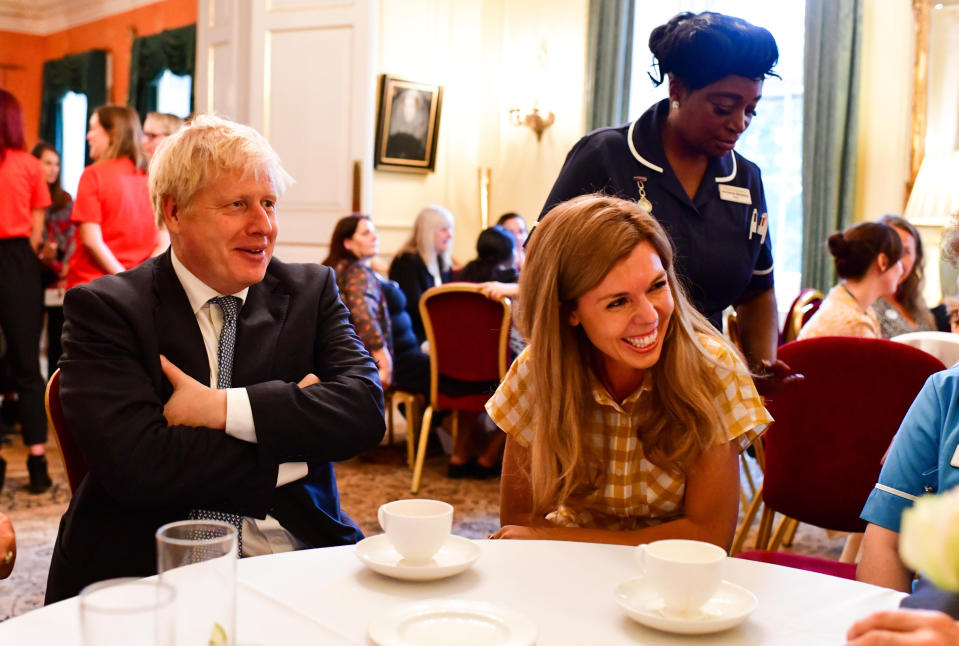 Carrie Symonds opted for a white and yellow gingham dress from Whistles to host a reception for six hospices at No.10 Downing Street in August <em>[Photo: Getty Images]</em>