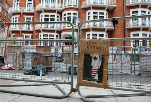 A poster is seen attached to a police barrier outside the Ecuadorian embassy in London, on August 15, where WikiLeaks founder Julian Assange is staying while awaiting a response from the Ecuadorian government on his asylum request. Assange sought refuge in the Ecuadoran embassy on June 19 and asked for asylum as he seeks to avoid extradition to Sweden