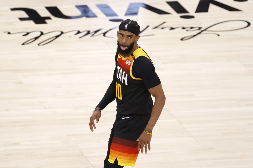 Mar 29, 2021; Salt Lake City, Utah, USA; Utah Jazz guard Mike Conley (10) reacts after making a three-pointer in the third quarter against the Cleveland Cavaliers at Vivint Smart Home Arena. 