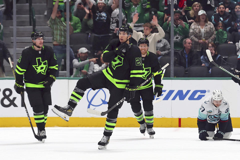 Dallas Stars left wing Jason Robertson (21) celebrates a goal against the Seattle Kraken during the second period of an NHL hockey game on Saturday, April 13, 2024, in Dallas. (AP Photo/Richard W. Rodriguez)