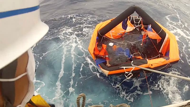 Filipino crew member of the Gulf Livestock 1 is rescued by Japan Coast Guard's crew members boarding the vessel Kaimon, at the East China Sea