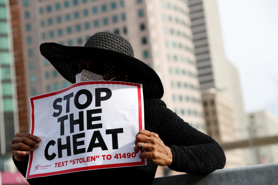 A demonstrator hols a sign as votes continue to be counted following the 2020 U.S. presidential election, in Detroit, Michigan on November 5, 2020.  (Shannon Stapleton/Reuters)