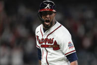 Atlanta Braves' Eddie Rosario celebrates after hitting a three run home run during the fourth inning in Game 6 of baseball's National League Championship Series against the Los Angeles Dodgers Saturday, Oct. 23, 2021, in Atlanta.(AP Photo/Ashley Landis)