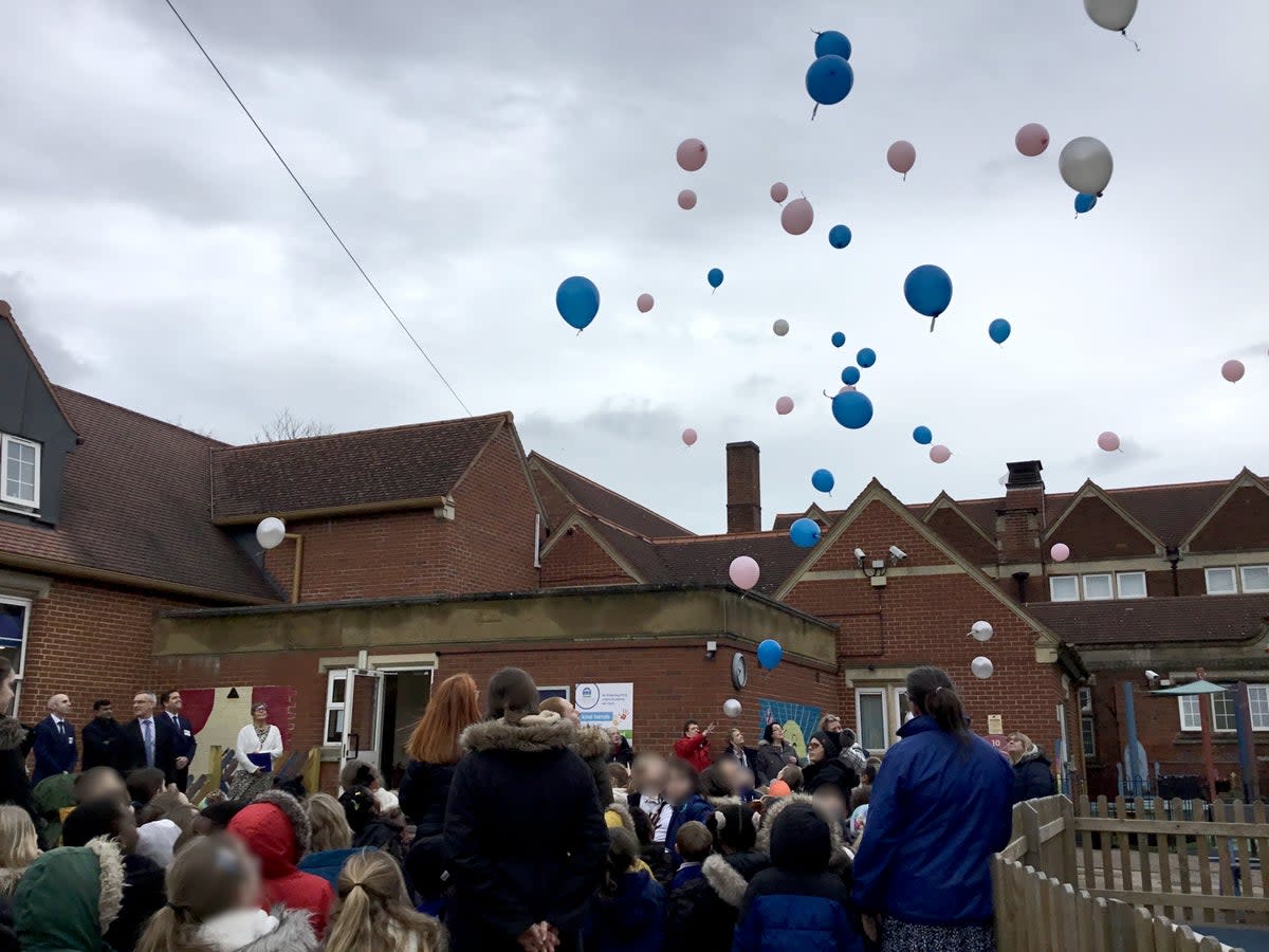 Jeeva and Janvi’s classmates release balloons into the sky as part of a rememberence ceremony for the murdered pupils (Northants Police)