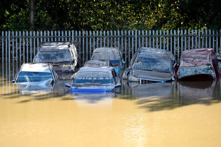 FILE PHOTO: Cars caught in flood water after Storm Callum passed through the town of Carmarthen, west Wales, Britain, October 14, 2018. REUTERS/Rebecca Naden/File Photo
