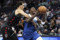 Washington Wizards forward Patrick Baldwin Jr., left, fouls Minnesota Timberwolves guard Anthony Edwards as he attempts a shot during the first half of an NBA basketball game, Tuesday, April 9, 2024, in Minneapolis. (AP Photo/Matt Krohn)