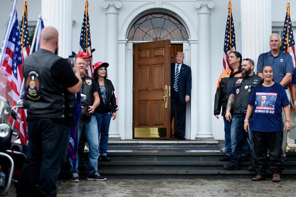 US President Donald Trump greets supporters during a Bikers for Trump event at the Trump National Golf Club August 11, 2018 in Bedminster, New Jersey. - Trump welcomed approximately 180 bikers made up of Veterans, law enforcement, supporters and members from the Bikers for Trump New Jersey chapter. (Photo by Brendan Smialowski / AFP)        (Photo credit should read BRENDAN SMIALOWSKI/AFP via Getty Images)