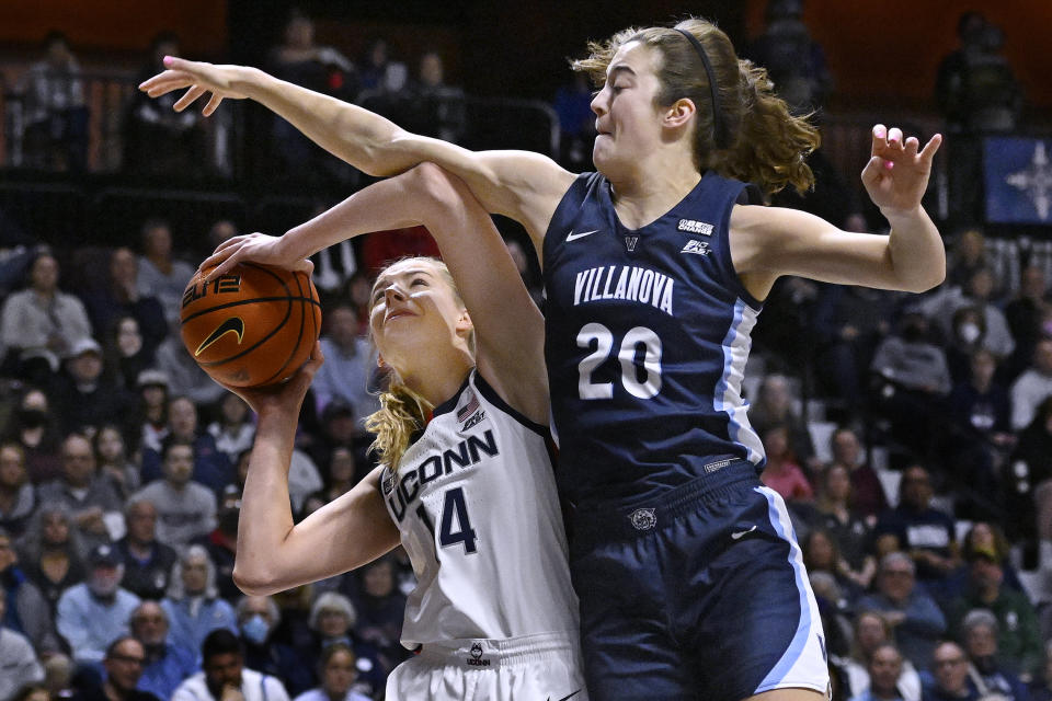 Villanova's Maddy Siegrist (20) fouls UConn's Dorka Juhasz (14) during the first half of an NCAA college basketball game in the finals of the Big East Conference tournament, Monday, March 6, 2023, in Uncasville, Conn. (AP Photo/Jessica Hill)