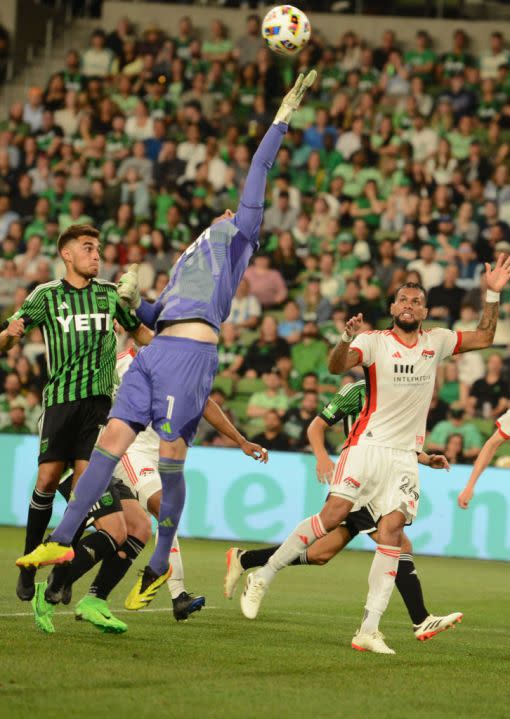 AUSTIN, TX – APRIL 06: Austin FC goalie <a class="link " href="https://sports.yahoo.com/soccer/players/373319/" data-i13n="sec:content-canvas;subsec:anchor_text;elm:context_link" data-ylk="slk:Brad Stuver;sec:content-canvas;subsec:anchor_text;elm:context_link;itc:0">Brad Stuver</a> (1) tips a ball away as San Jose Earthquakes defender Rodrigues (26) looks on during game between the San Jose Earthquakes and Austin FC on April 6, 2024 at Q2 Stadium in Austin, TX. (Photo by John Rivera/Icon Sportswire via Getty Images)