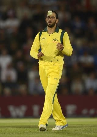 File photo of Australia's Fawad Ahmed during the first T20 international against England at the Rose Bowl cricket ground, Southampton August 29, 2013. REUTERS/Philip Brown