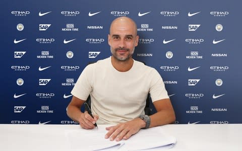 Pep Guardiola signs contract extension - Credit: PA