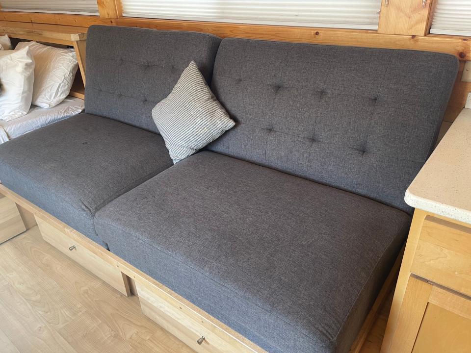 gray couch in tiny home airbnb near disneyland