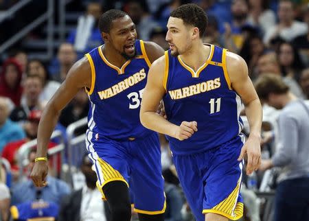 Jan 22, 2017; Orlando, FL, USA; Golden State Warriors forward Kevin Durant (35) congratulates guard Klay Thompson (11) during the second half at Amway Center. Golden State Warriors defeated the Orlando Magic 118-98. Mandatory Credit: Kim Klement-USA TODAY Sports