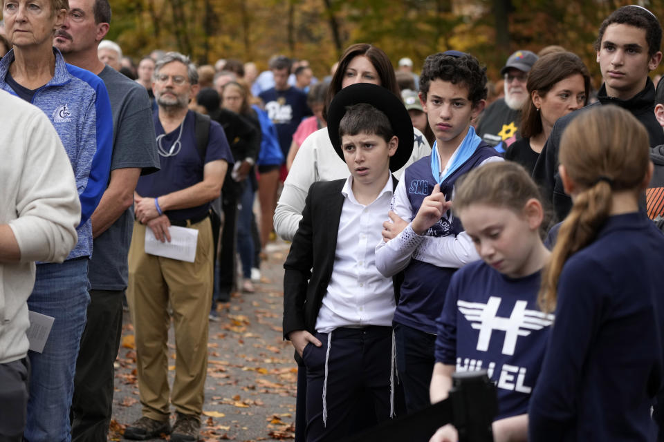 People gather for a Commemoration Ceremony, on Friday, Oct. 27, 2023, in Schenley Park, in the Squirrel Hill neighborhood of Pittsburgh, to remember the 11 worshippers killed by a gunman at the Tree of Life synagogue five years ago. (AP Photo/Gene J. Puskar)