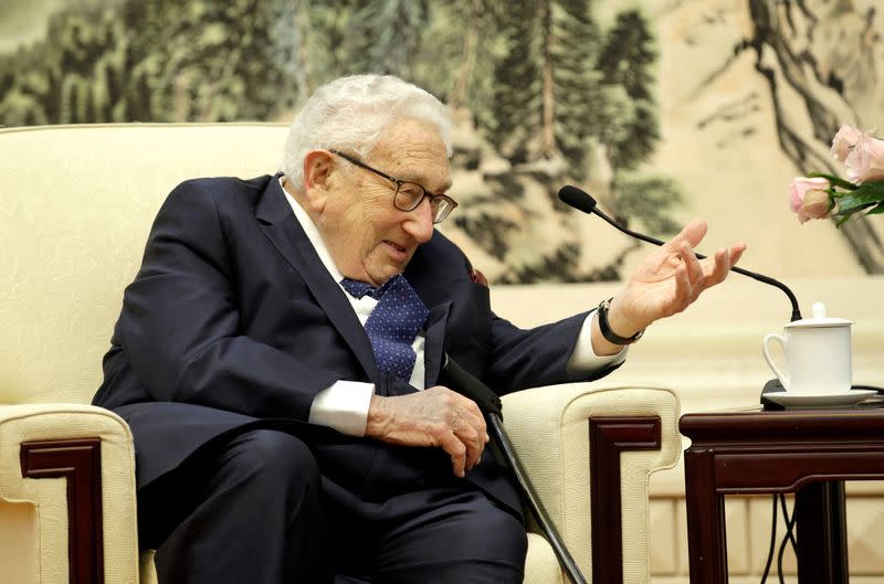 FILE PHOTO: Former U.S. Secretary of State Henry Kissinger speaks during a meeting with Chinese Foreign Minister Wang Yi in Beijing