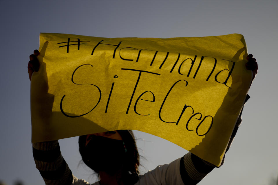 A woman holds a banner with a message reading in Spanish; "Sister, I do believe you" during a protest outside the San Bernardo Convent, in Salta, Argentina, Tuesday, May 3, 2022. Several feminist groups protested in support of the eighteen cloistered nuns from the convent who have made a formal allegation against the Archbishop Mario Cargnello of Salta and two other members of the church for alleged physical and psychological gender violence. (AP Photo/Natacha Pisarenko)