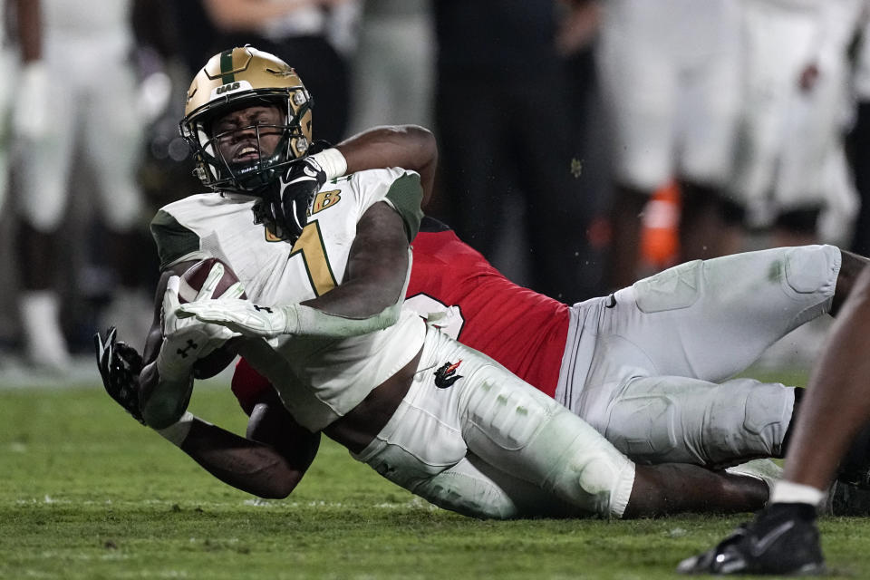 UAB running back Jermaine Brown Jr. (1) is dragged down by Georgia linebacker Raylen Wilson (5) during the second half of an NCAA college football game, Saturday, Sept. 23, 2023, in Athens, Ga. (AP Photo/John Bazemore)