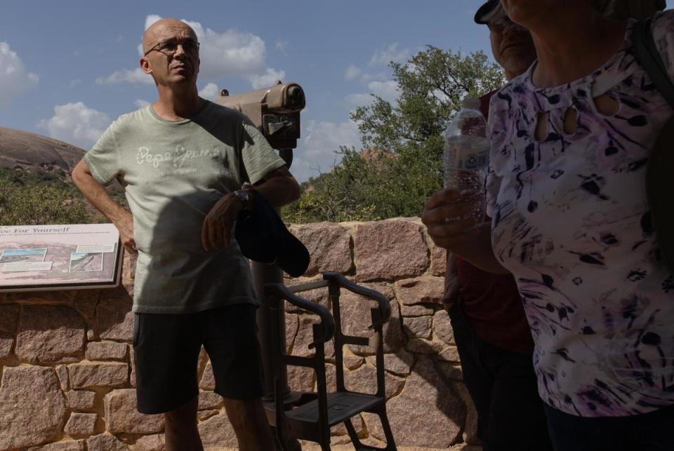 Ludwig Koop, along with family living in San Antonio, have made their way to Enchanted Rock State Natural Area while on summer visit to Texas from the Netherlands, on July 26, 2023.