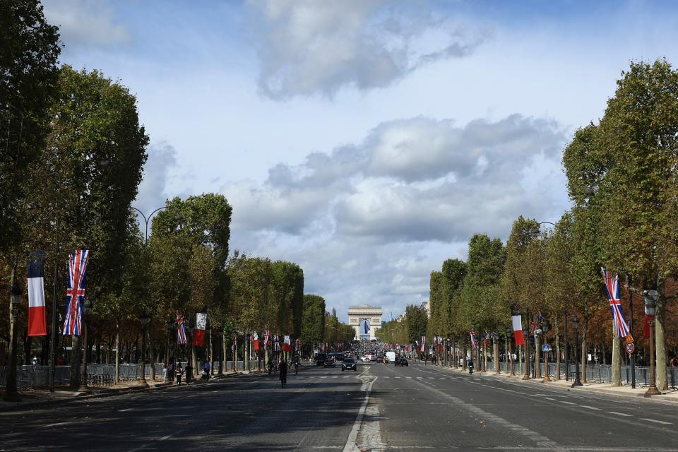 The Champs-Elysées is decorated with French and British flags (AP)